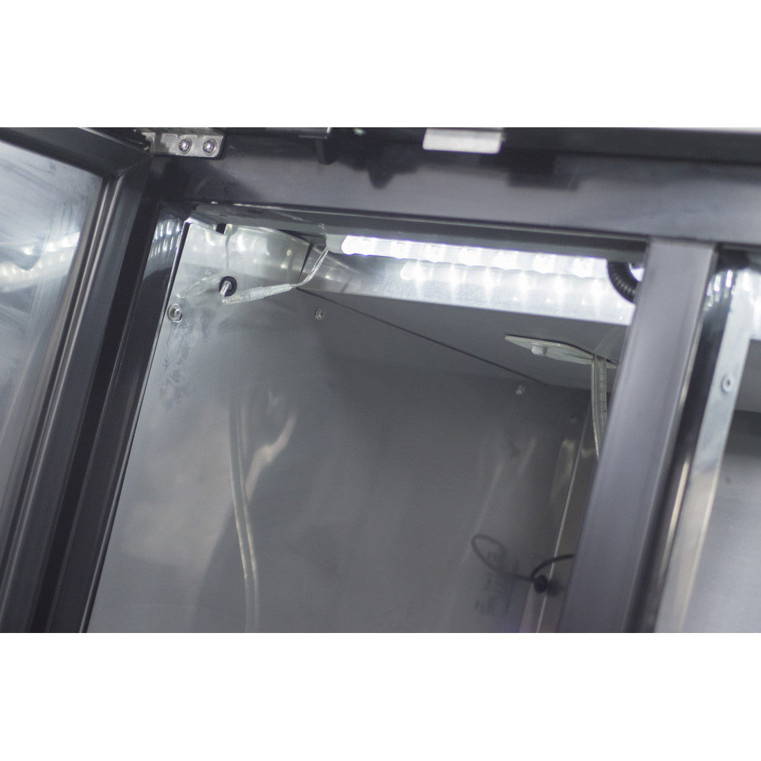 Interior view of the Prodis double tap keg cooler showing spacious keg storage and internal lighting