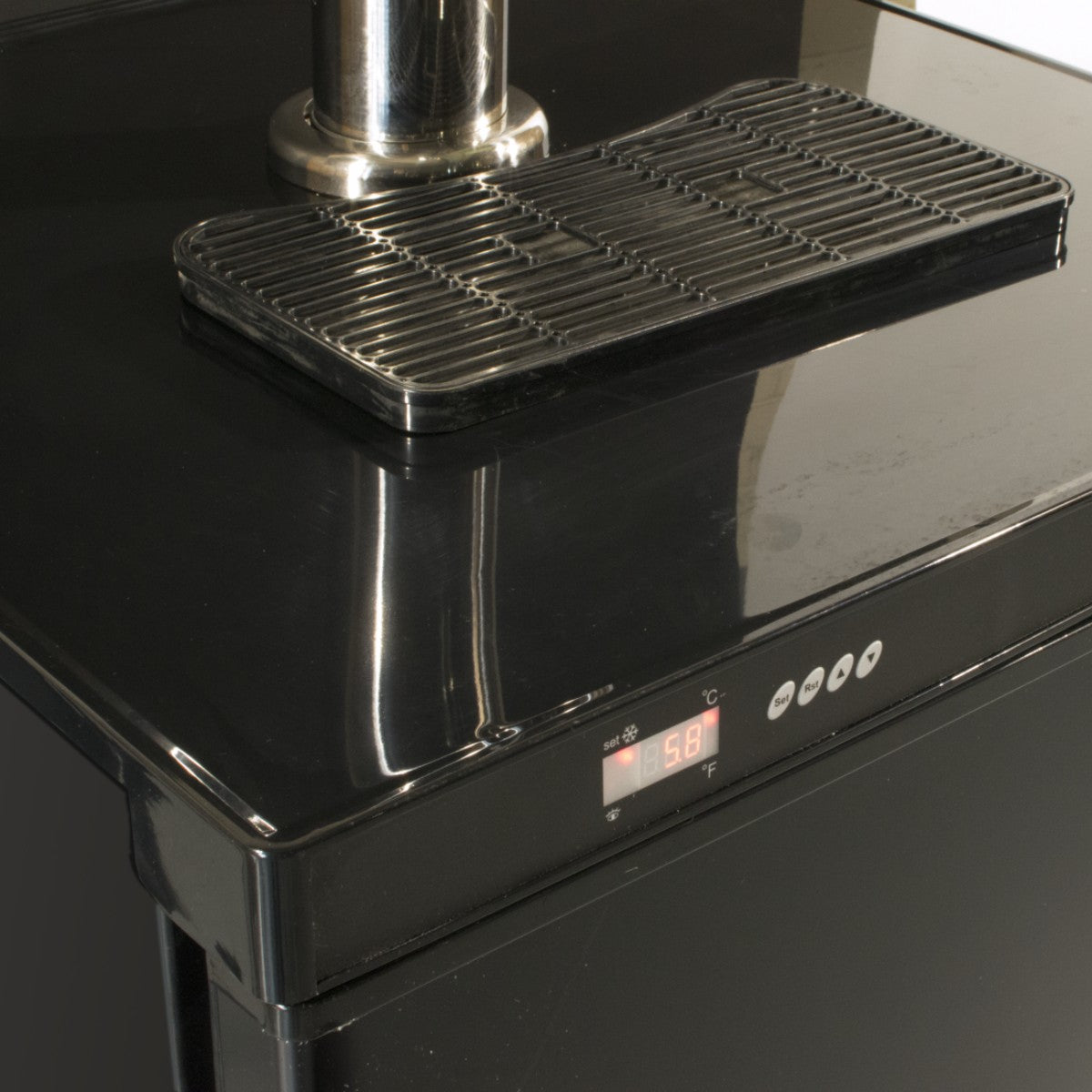 Detail view of the Prodis single tap keg cooler in black, highlighting the digital temperature display and drip tray on the glossy worktop