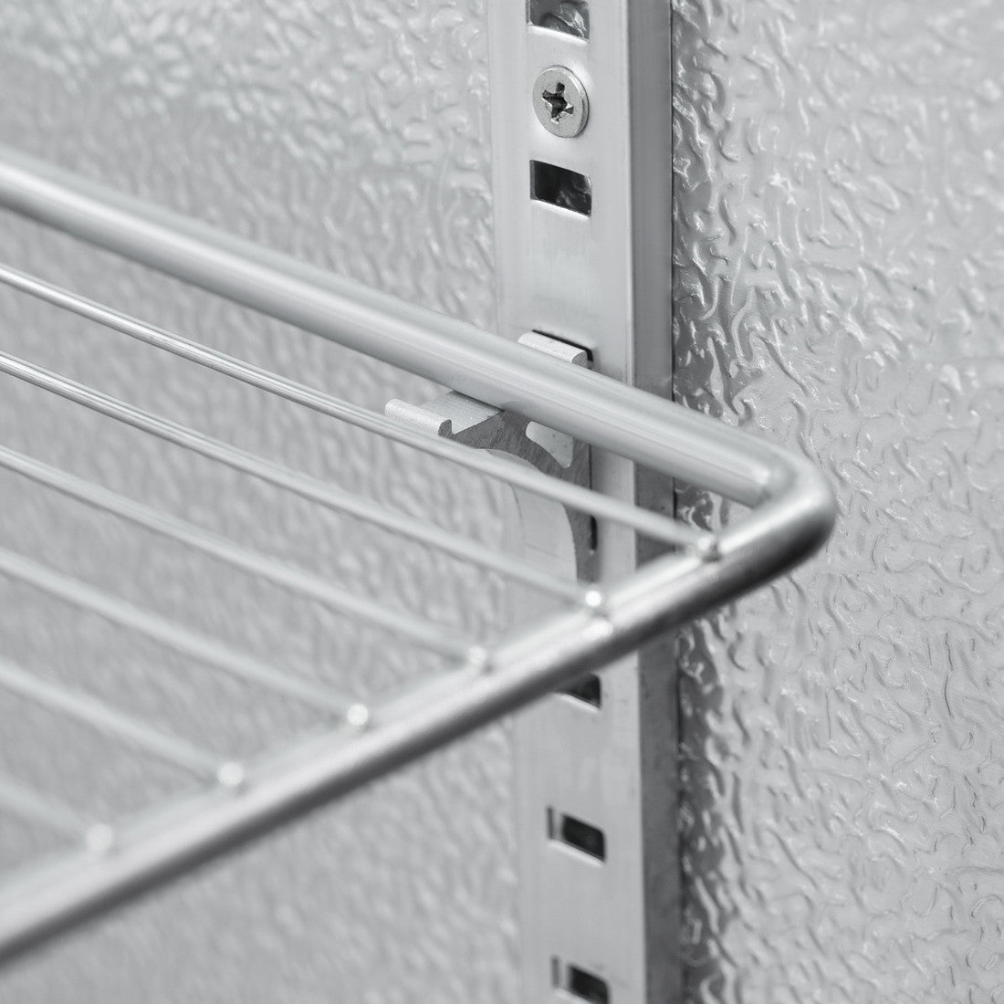 Close-up of the Prodis bottle cooler’s adjustable chrome shelf system, highlighting sturdy rails designed for flexible bottle storage