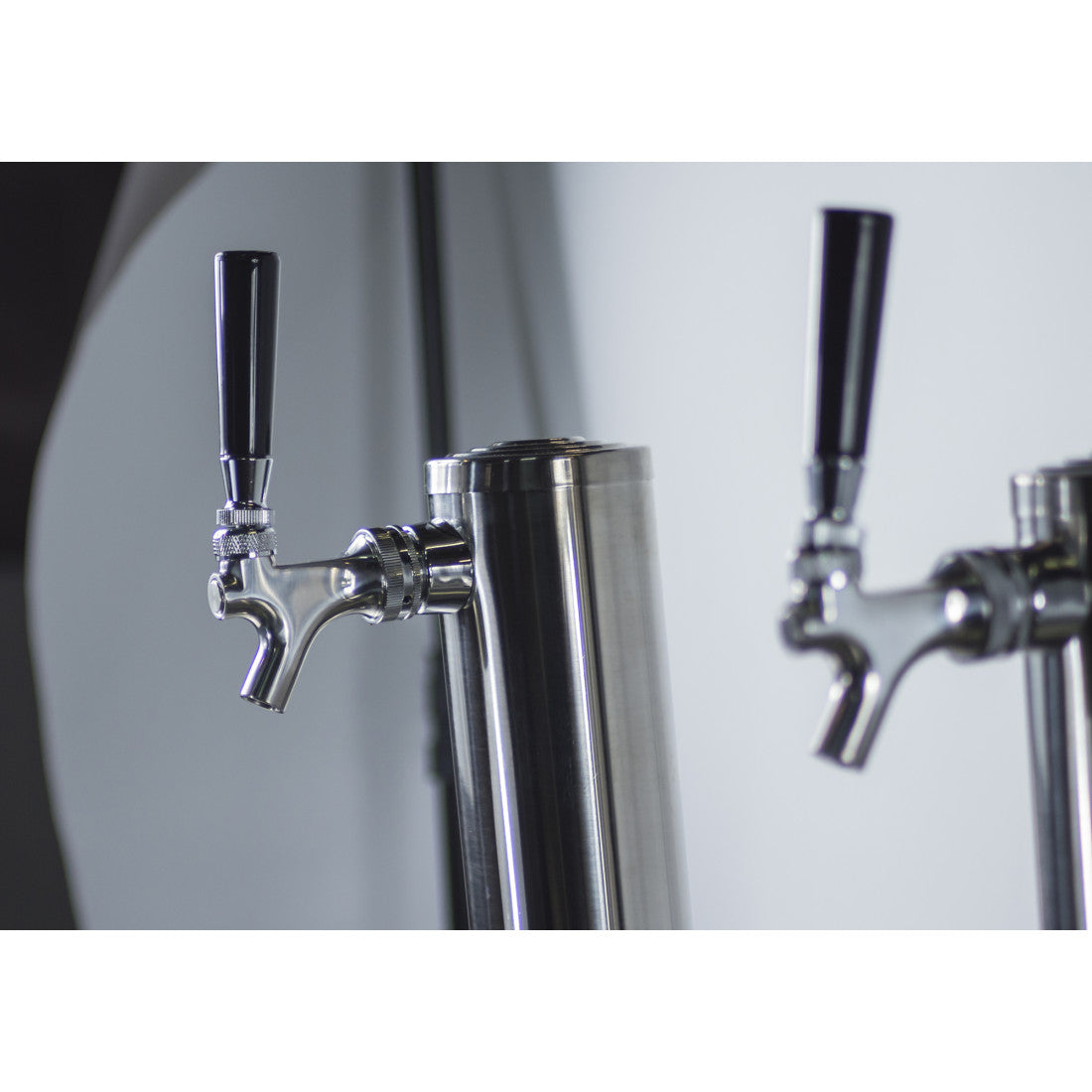 Front view of the Prodis double tap keg cooler in black, featuring twin stainless steel taps