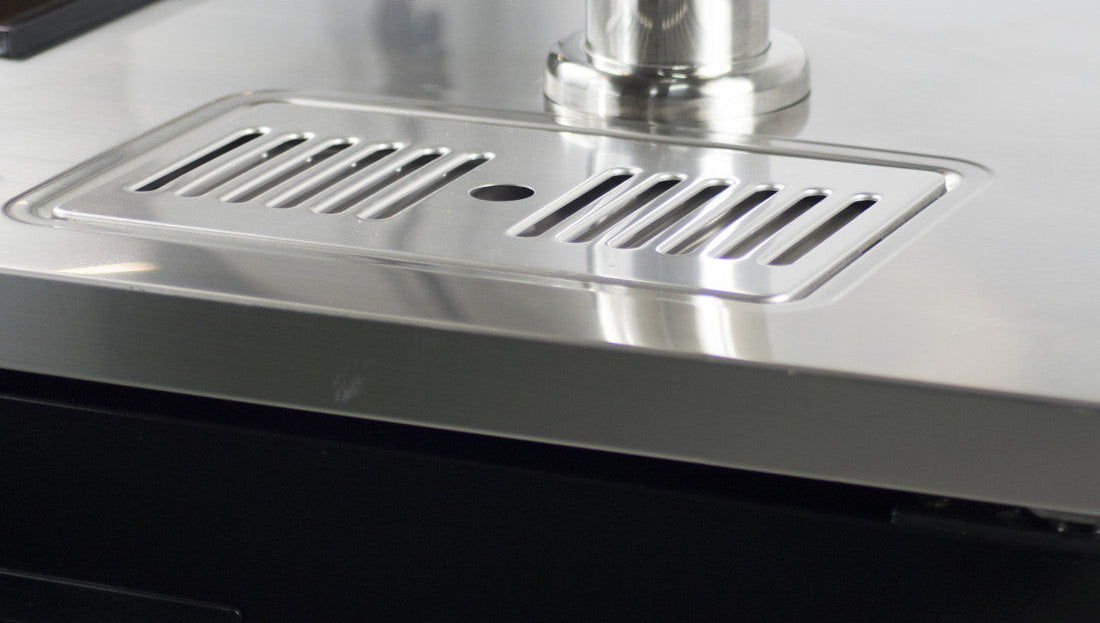 Close-up of the integrated stainless steel drip tray on the Prodis single door portable keg cooler top surface